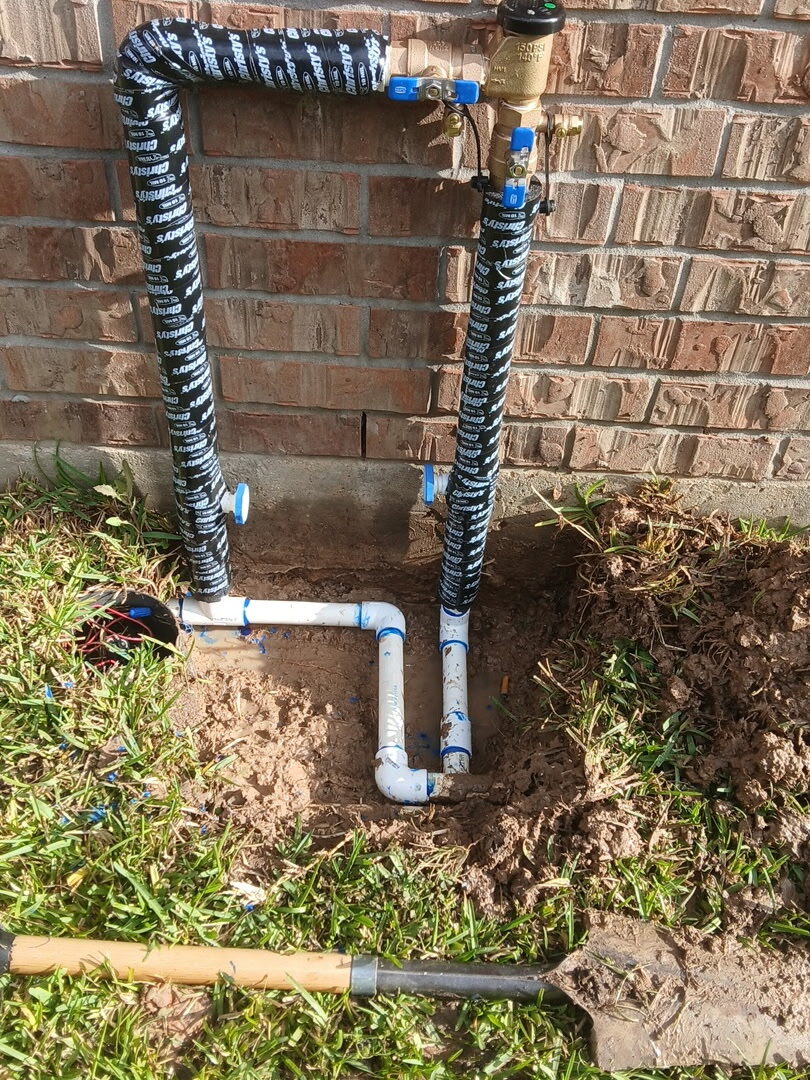 Rebuilt PVC valve manifold with braided connectors at a Katy home